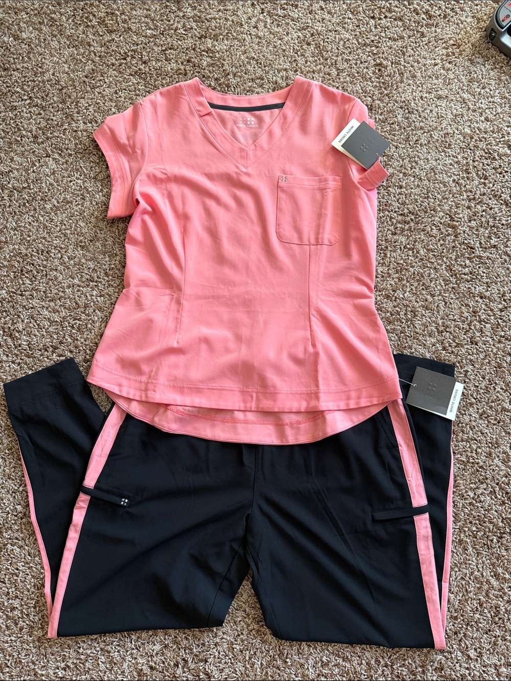 Women's scrub top large and black jogger pant extra large.  Comes as a set.